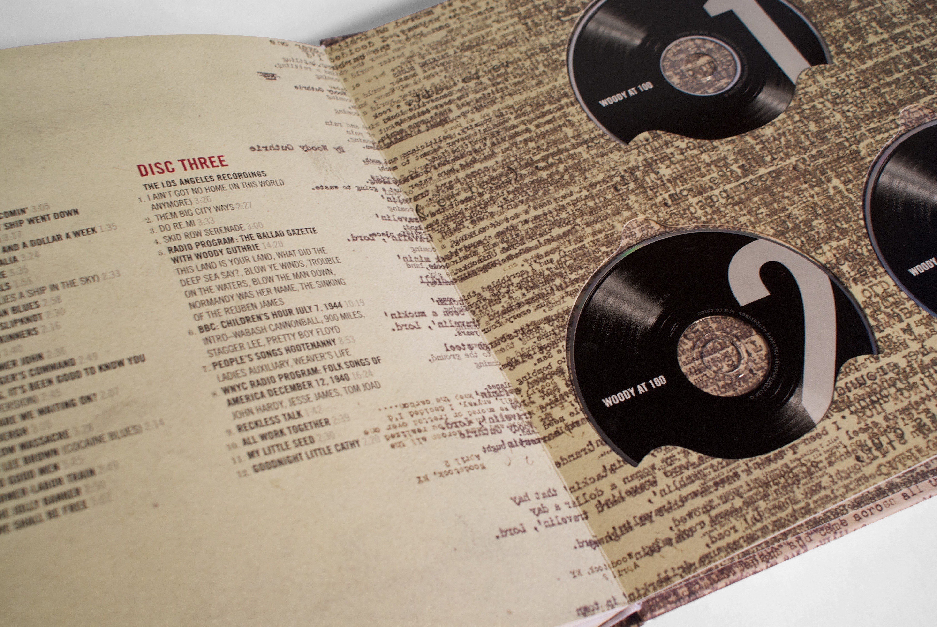 spread in book with track listings and cds in pockets